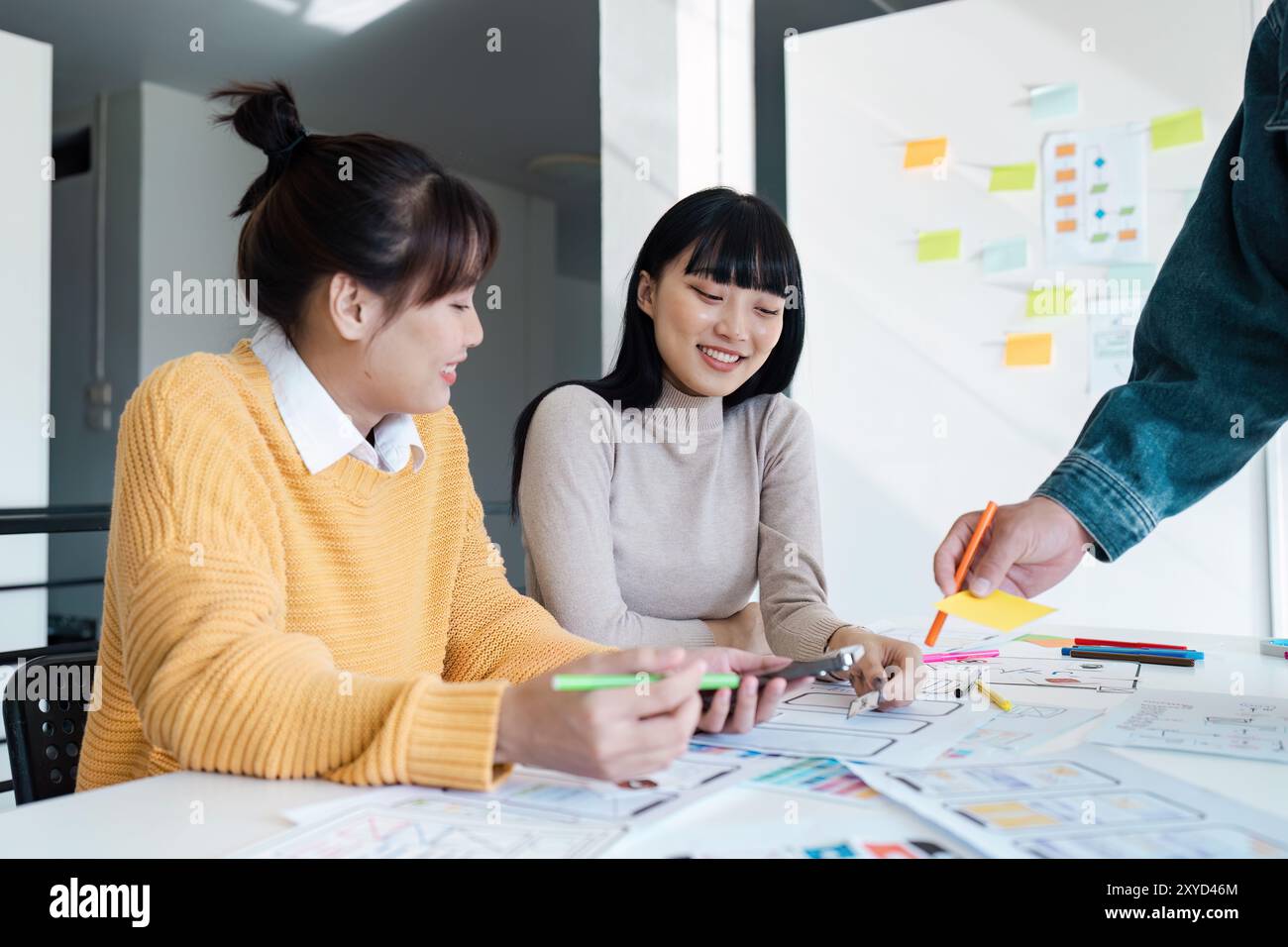 Creative Team Collaborating on UX UI Design Project in Modern Office ...