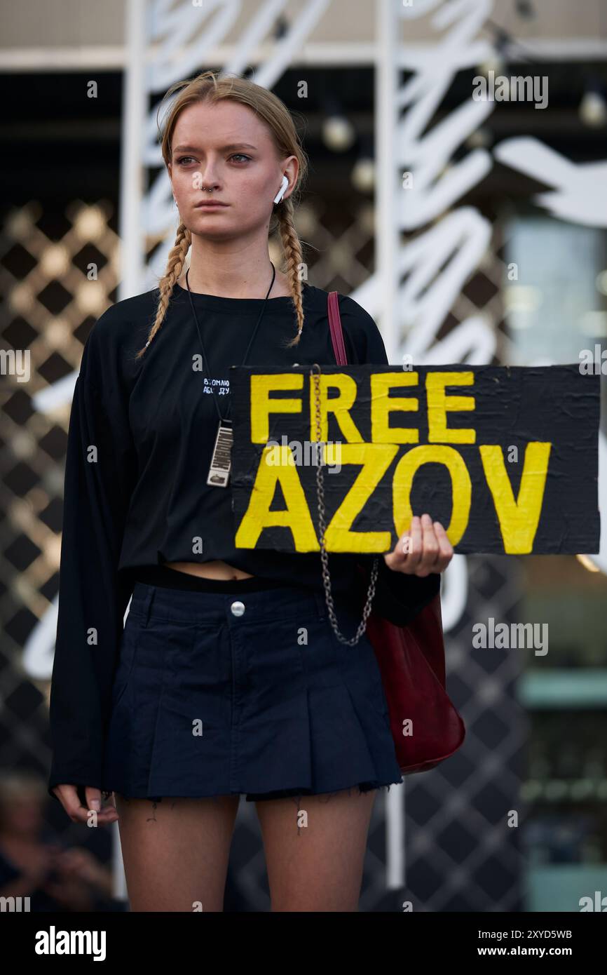 Young Ukrainian woman demonstrating with a sign Free Azov in Kyiv - 11 ...