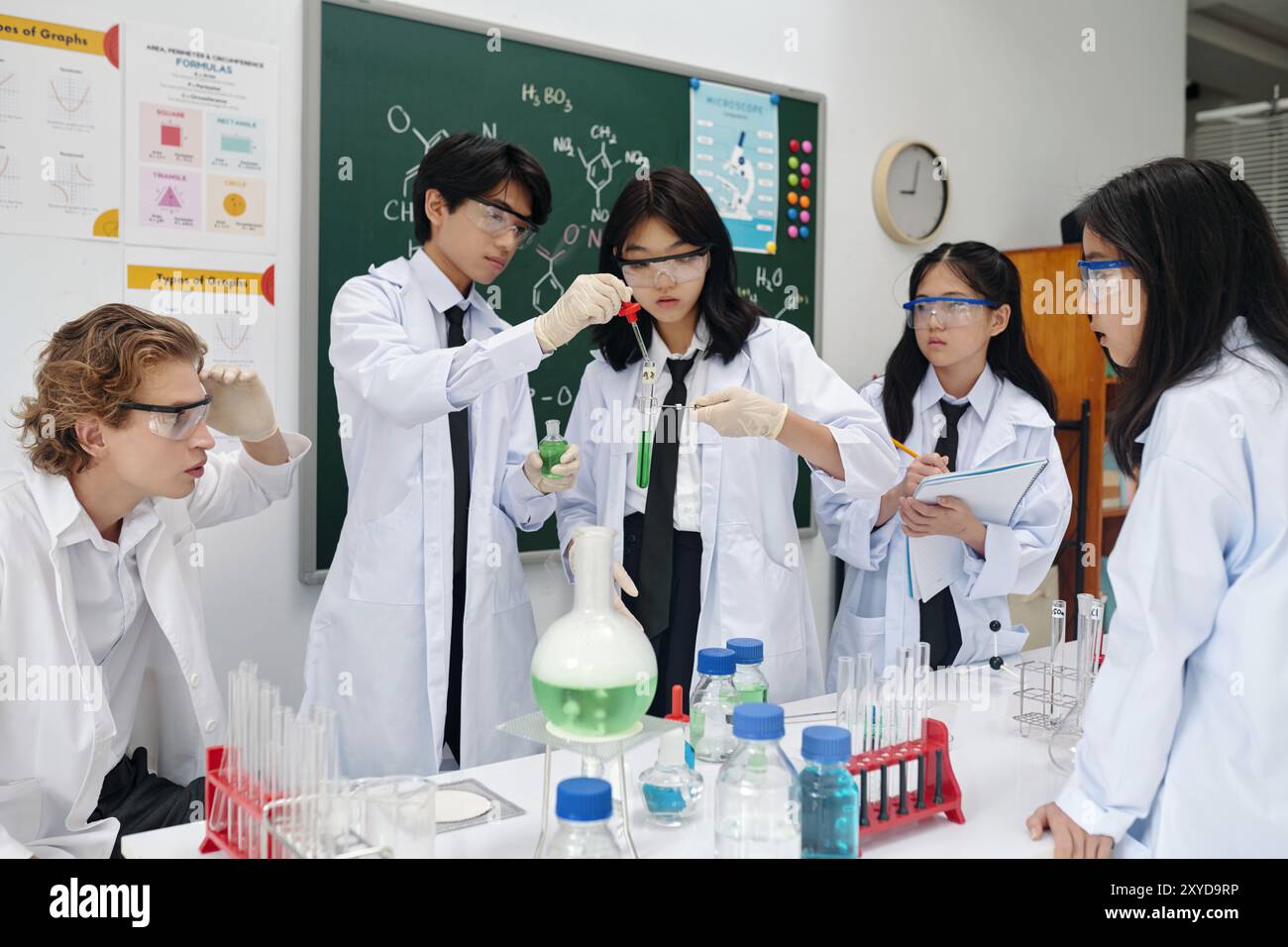 Engaging in chemical experiment hi-res stock photography and images - Alamy