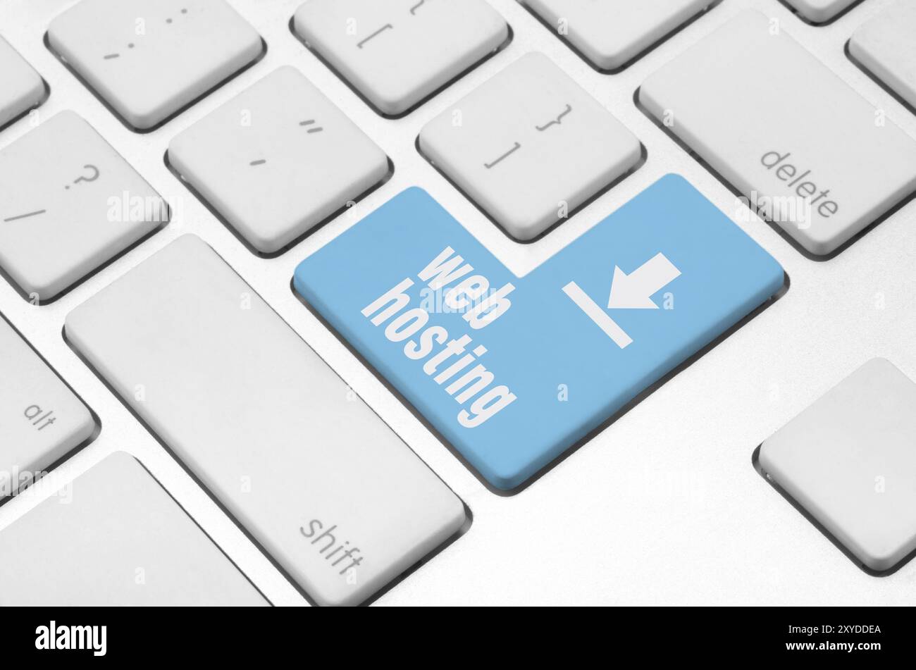 Internet concept: web hosting key on the computer keyboard Stock Photo