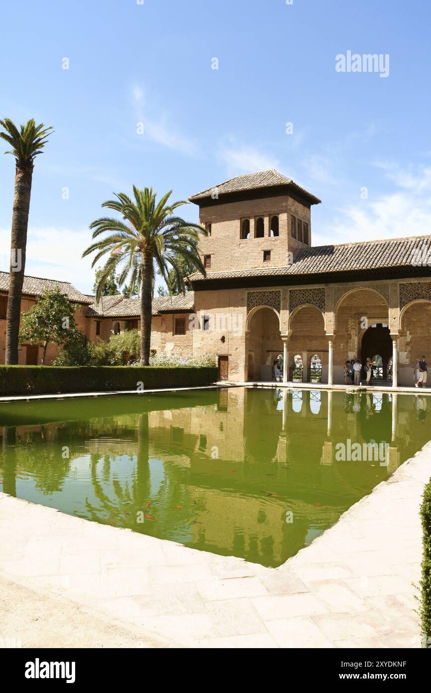 Granada, Spain, August 14, 2011: Ladies Tower (Torre de las Damas) and Gardens of the Partal at the Alhambra in Granada. This moorish building built i Stock Photo