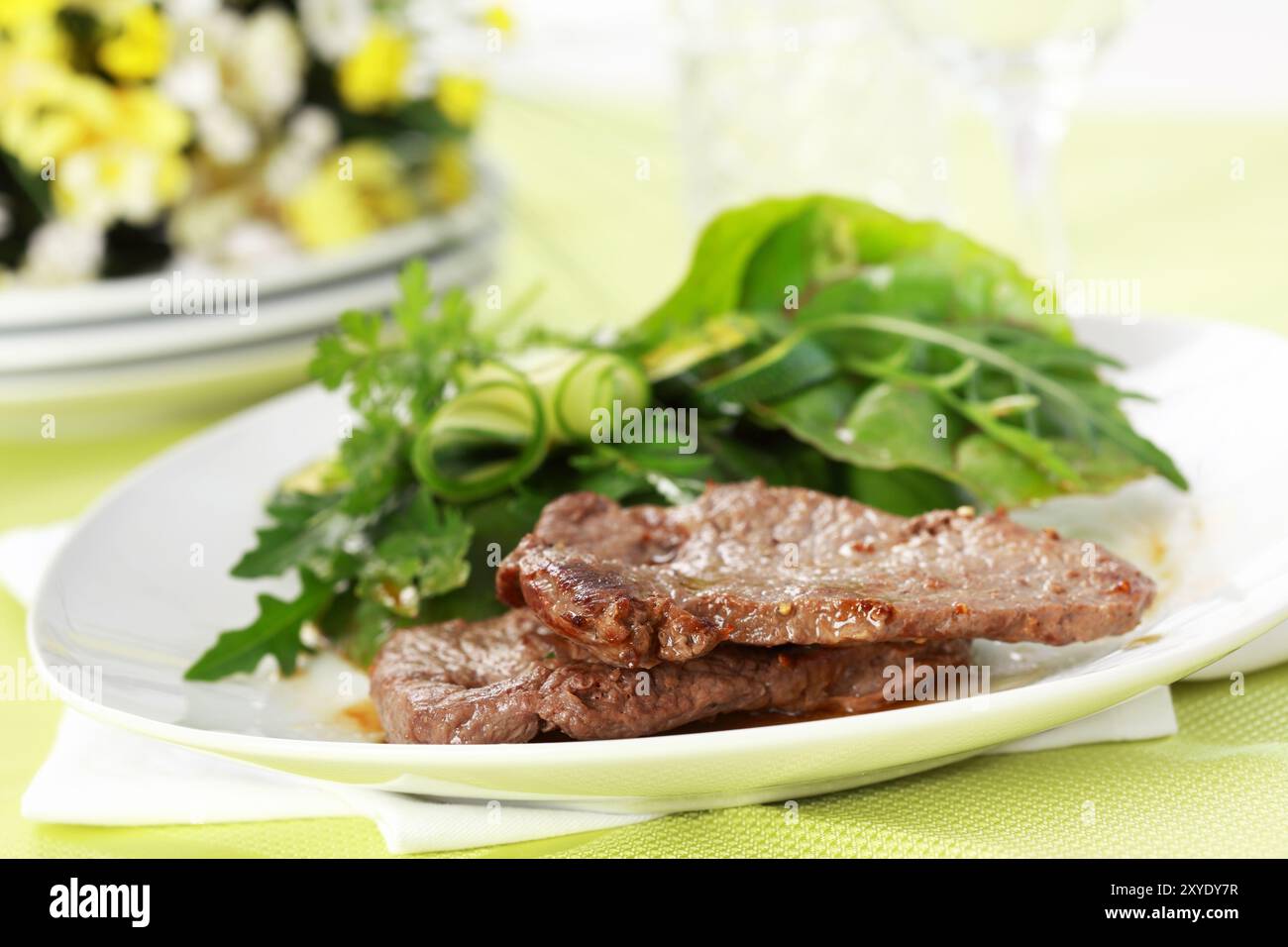 Beef steak with mixed green salad Stock Photo