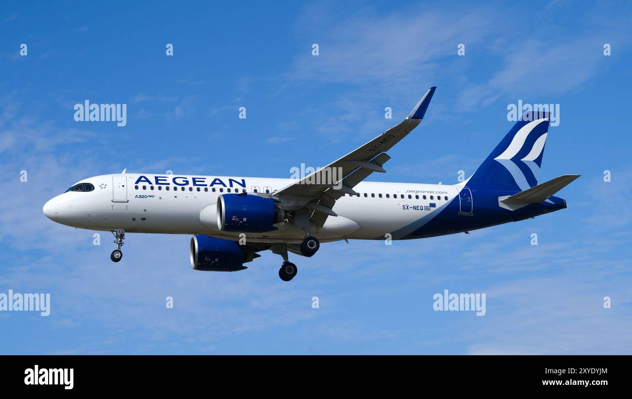 Aegean Airlines Airbus A320 Neo landing with a clear blue sky. London - 28th August 2024 Stock Photo