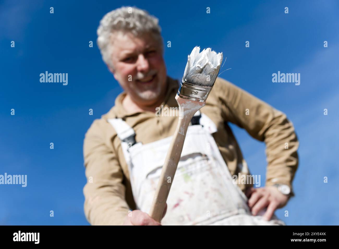 Craftsman with a paintbrush in his hand Stock Photo