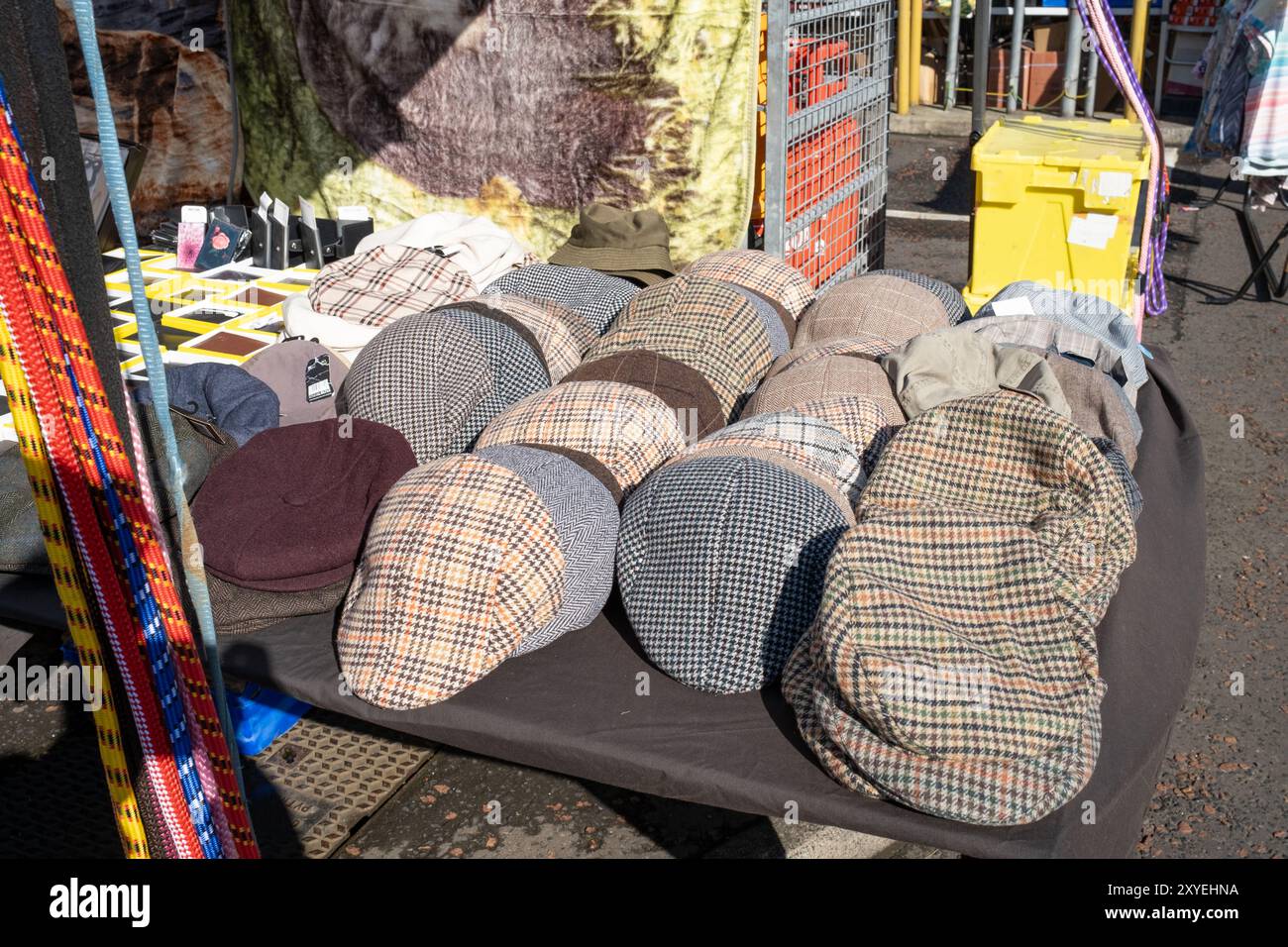 Country caps, brown checked tweed style patterns, assortment stacked in ...