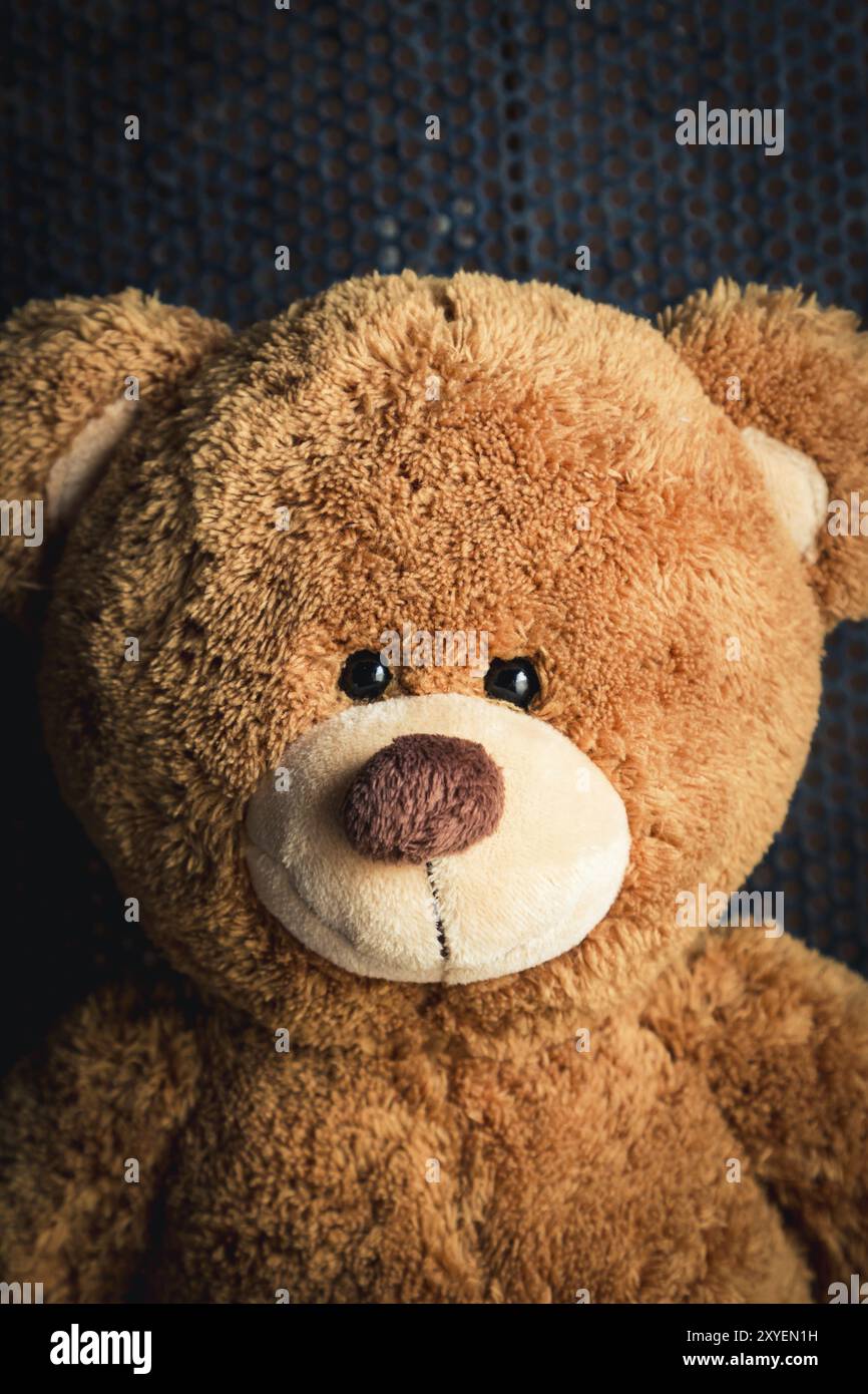Cute teddy bear with old metal background Stock Photo - Alamy