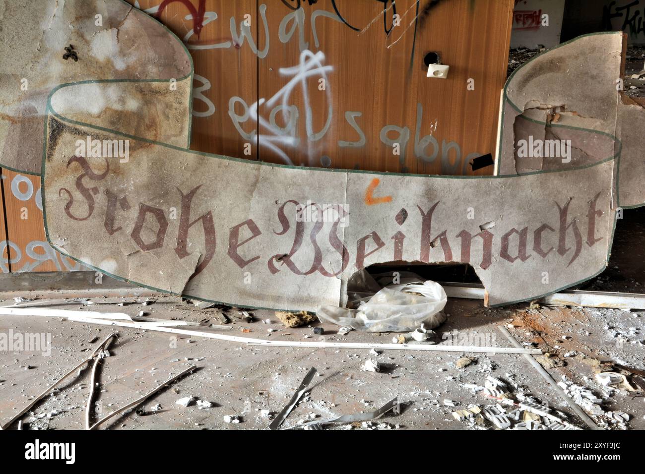 The remains of a Christmas party in an abandoned restaurant Stock Photo