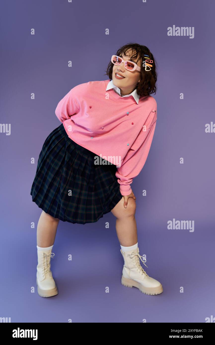 A young woman in vibrant attire, posing playfully on a purple backdrop ...