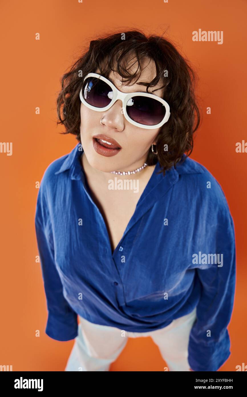 Woman wearing orange shirt hi-res stock photography and images - Alamy