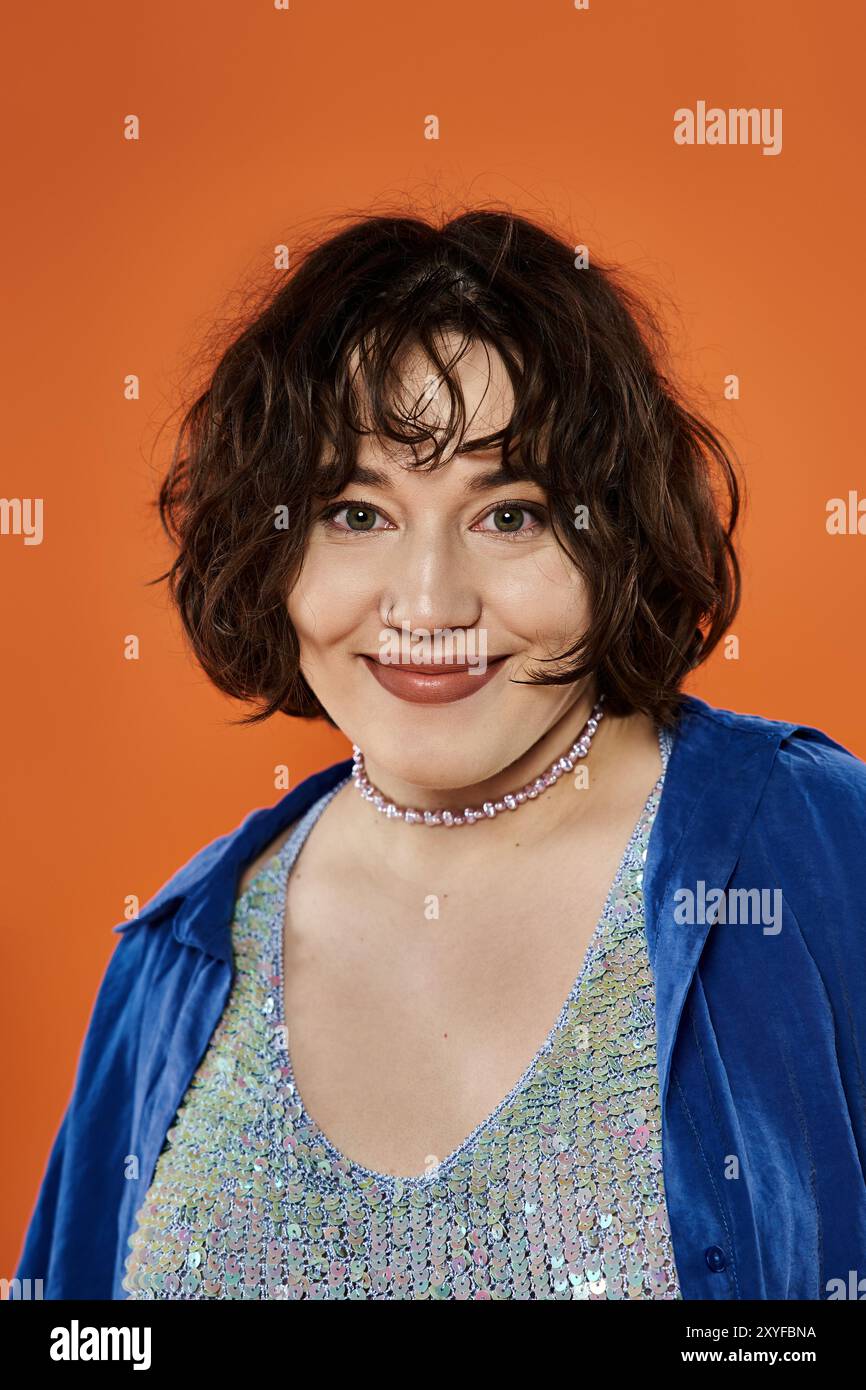 A woman smiles warmly at the camera Stock Photo - Alamy