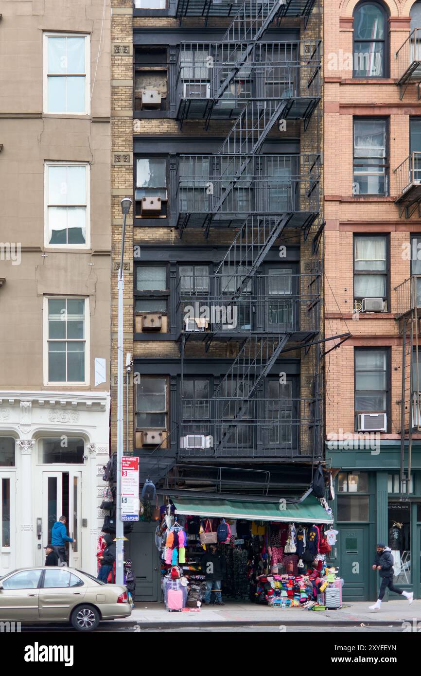 New York, United States - August 27, 2024: Street view in Chinatown, New York, featuring a vibrant shop and typical urban architectural details, inclu Stock Photo