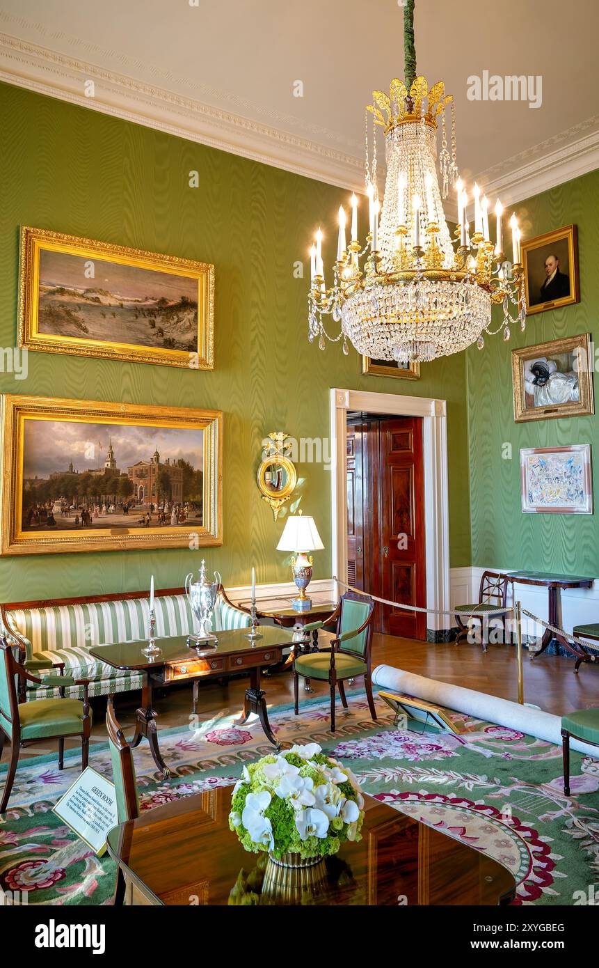 Green Room White House Washington DC // WASHINGTON DC — The Green Room in the White House, one of the state parlors on the first floor. This historic room has served as a reception room and parlor for distinguished guests since the early 19th century. The Green Room features Federal-style furniture and American paintings from the early Republic period. Stock Photo