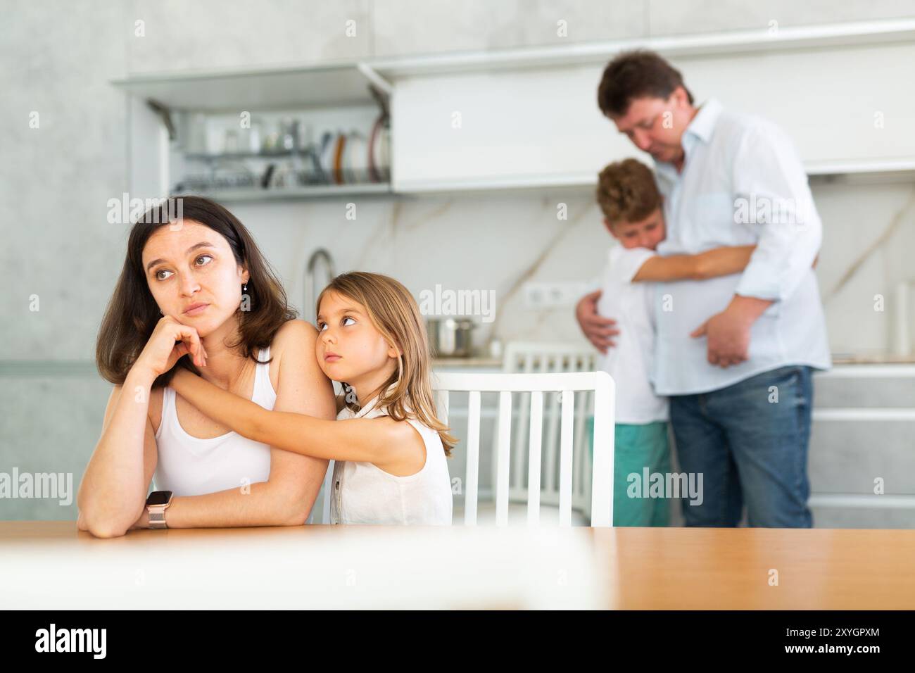 Domestic quarrel in big family - daughter hugging upset mom, son ...