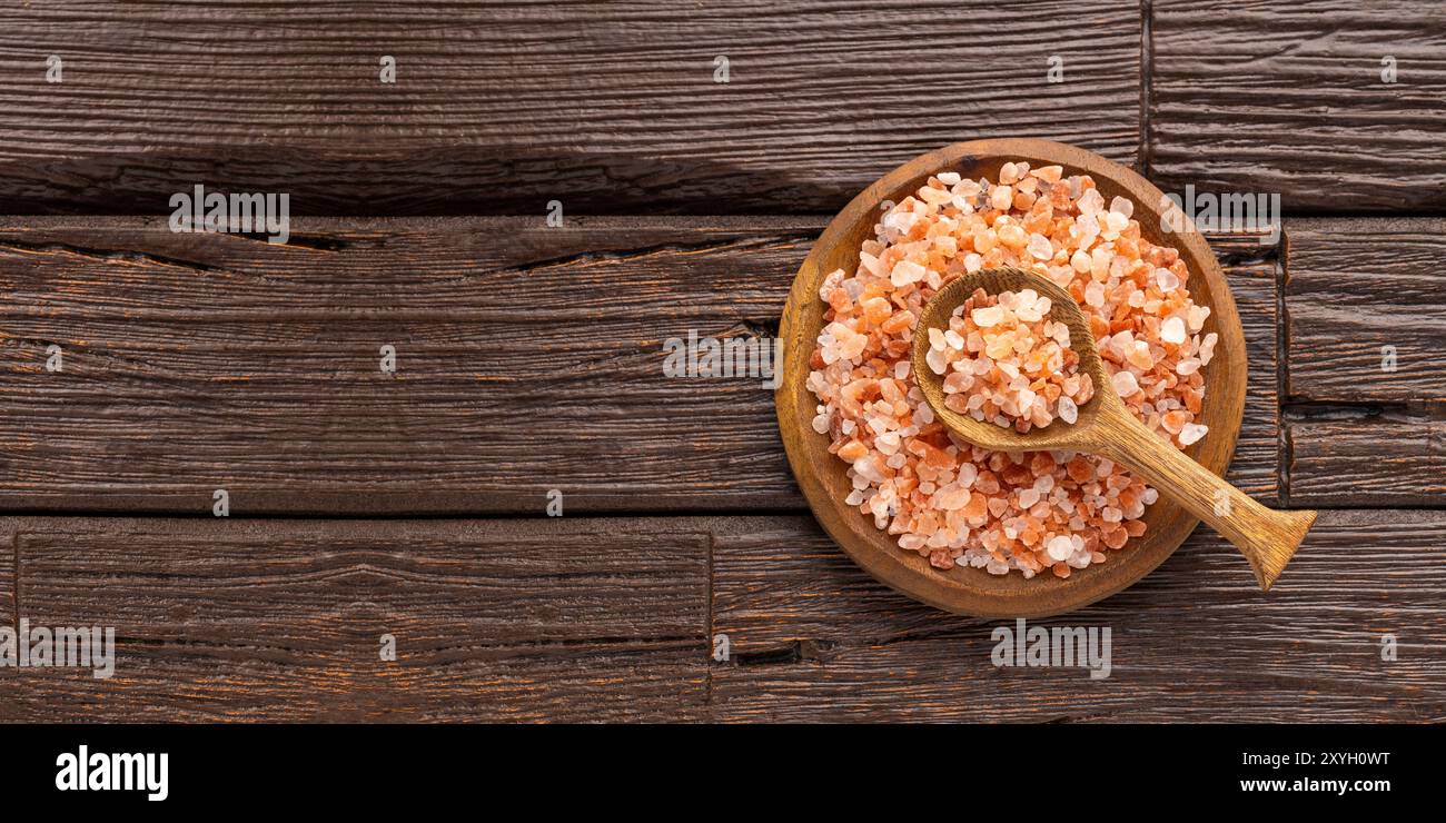 Fine pink Himalayan salt in the bowl and spoon Exotic ingredient for