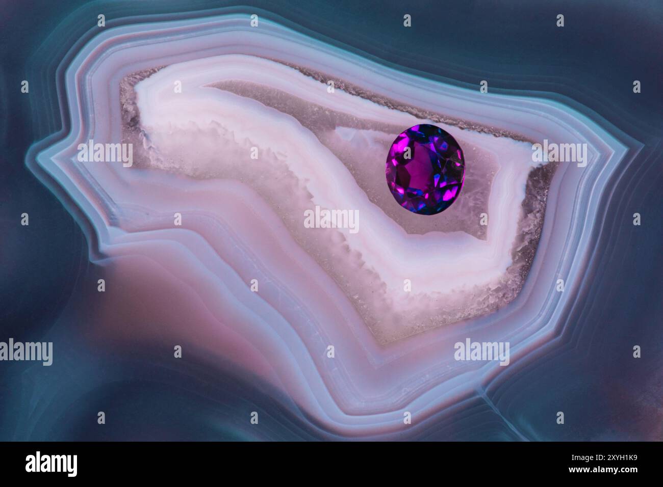 Gorgeous Amethyst Gemstone on a Beautifully Patterned Agate Thunderegg Stock Photo