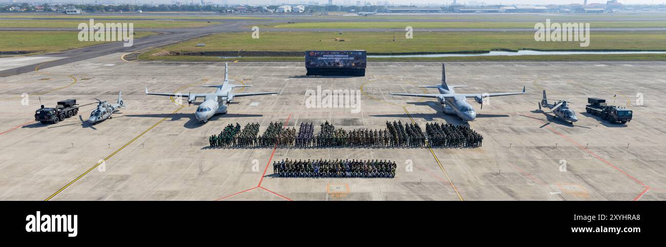 Multinational service members pose for a group photo following the ...