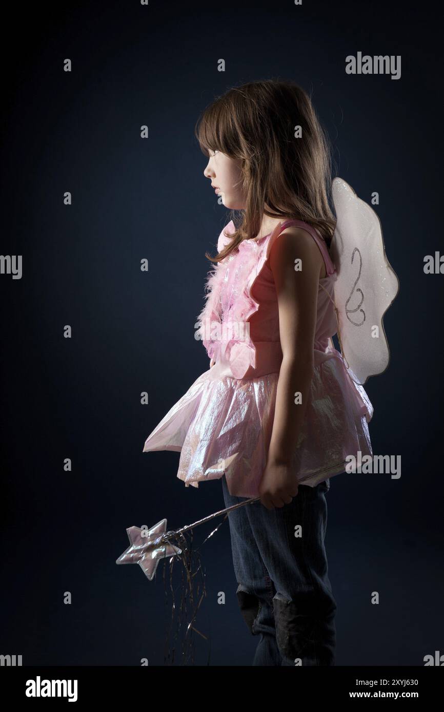 Little girl dressed up as a fairy with a magic wand Stock Photo - Alamy
