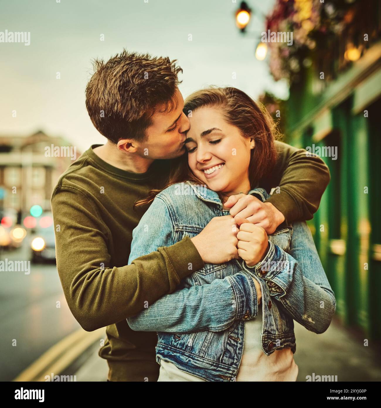 Happy couple, hug and embrace with love in city for warmth, support or ...