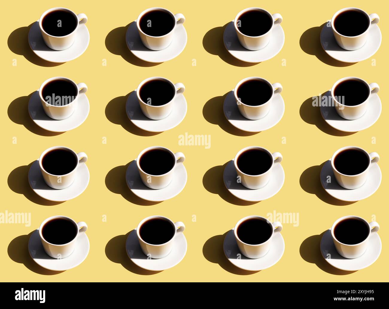 Pattern of white cup and saucer plate of black espresso coffee top view with shadow of sun on beige terracotta background. Stock Photo