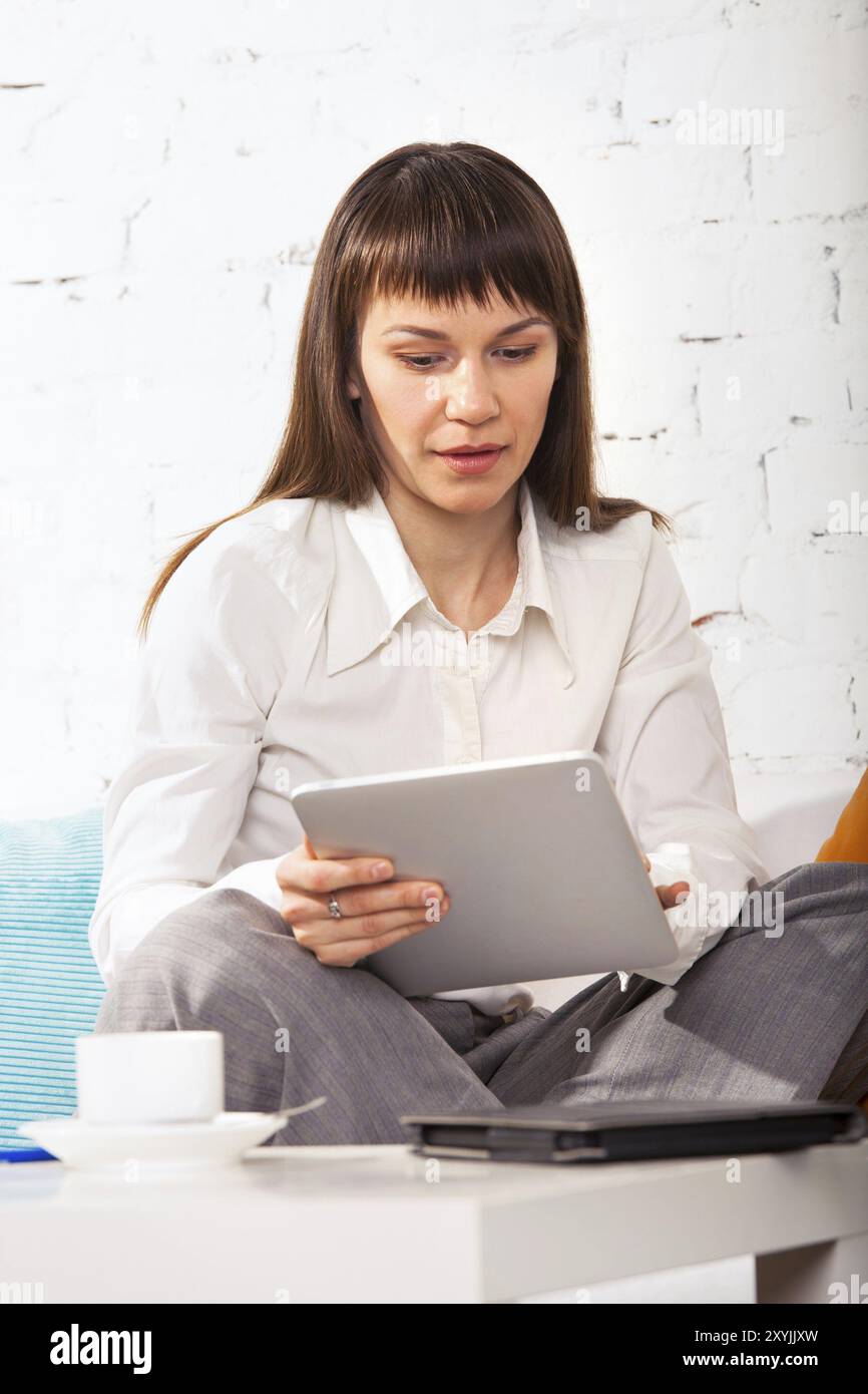 Woman watching photos on tablet hi-res stock photography and images - Alamy