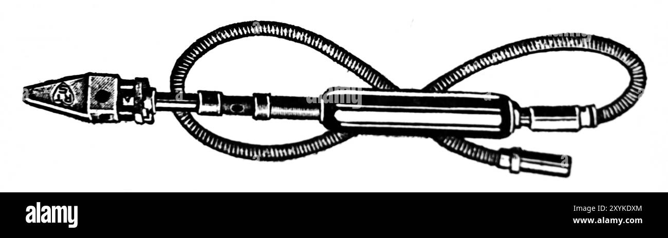 A gas-heated soldering iron. This photograph is from a large selection of mainly unattributed engineering illustrations and printed photos which were originally published in 1936. The sizes and quality of the originals vary quite widely. Stock Photo