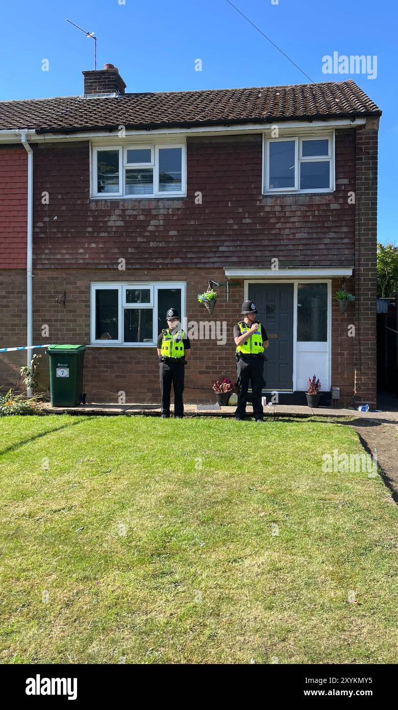 HOUSE NUMBER PIXELATED BY PA PICTURE DESK Police officers at the scene ...