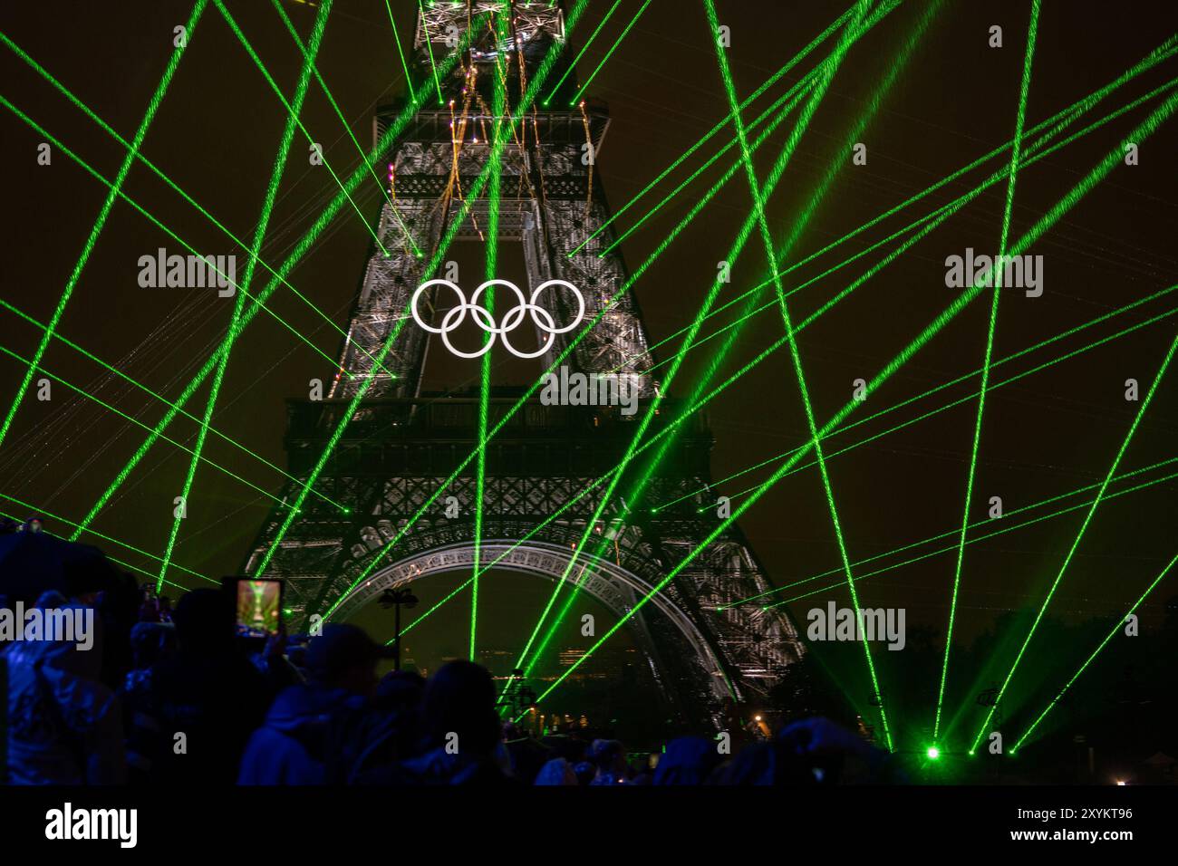 A crowd watches the opening ceremony of the 2024 Olympic Games on Friday, July 26, 2024,in Paris, France. Stock Photo