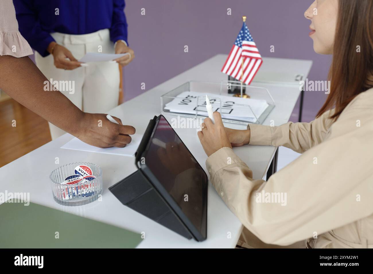 Woman Registrating Voters At Election Day Stock Photo