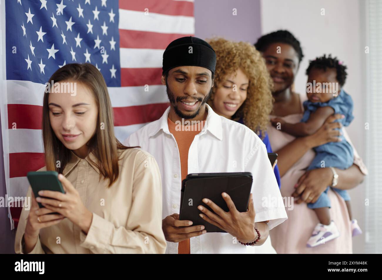 People Standing In Queue In Voting Centre Stock Photo - Alamy