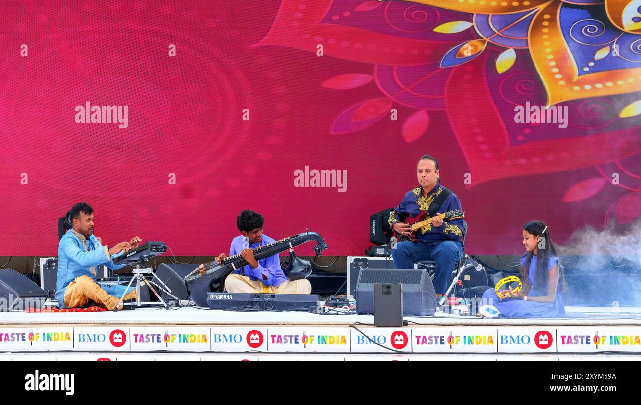 A live performance by a musical group on the Nathan Phillips Stage during the Taste of India festival. Stock Photo