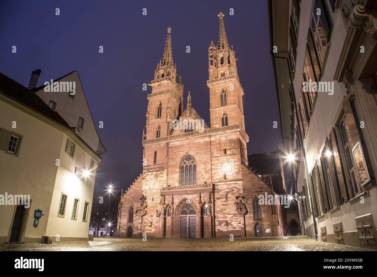 Exterior view of the illuminated Basel Minster at night Stock Photo