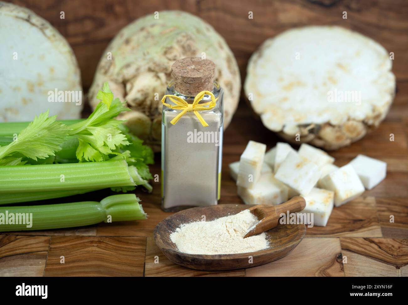 Celery, Celeriac, Turnip-rooted celery, Knob celery (Apium graveolens var. rapaceum, Apium graveolens rapaceum, Apium rapaceum), halved, diced and ser Stock Photo