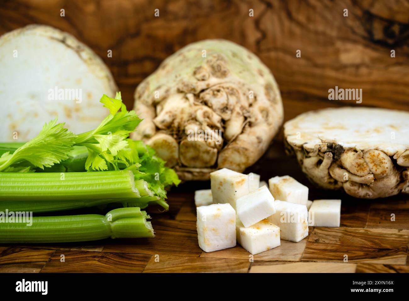 Celery, Celeriac, Turnip-rooted celery, Knob celery (Apium graveolens var. rapaceum, Apium graveolens rapaceum, Apium rapaceum), halved and diced Stock Photo