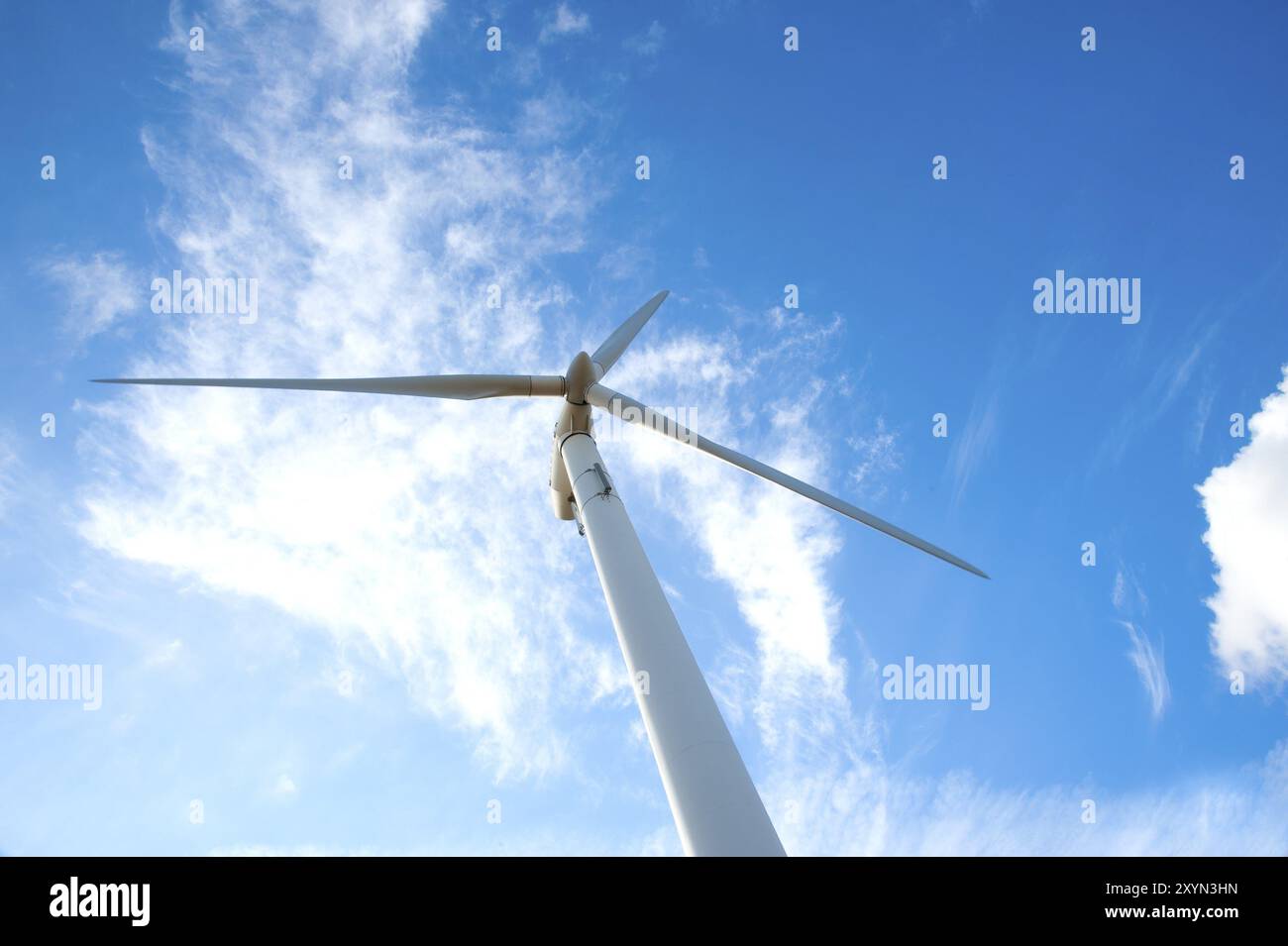 Wind Rotorblades The rotor blades of a wind turbine in front of a blue sky with veiling ...