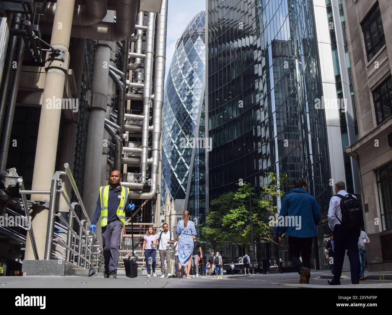 London, UK. 30th August 2024. People walk outside office buildings in the City of London, the capital's financial district, as new government plans could give employees the option to work fewer days a week for longer hours .Credit: Vuk Valcic/Alamy Live News Stock Photo