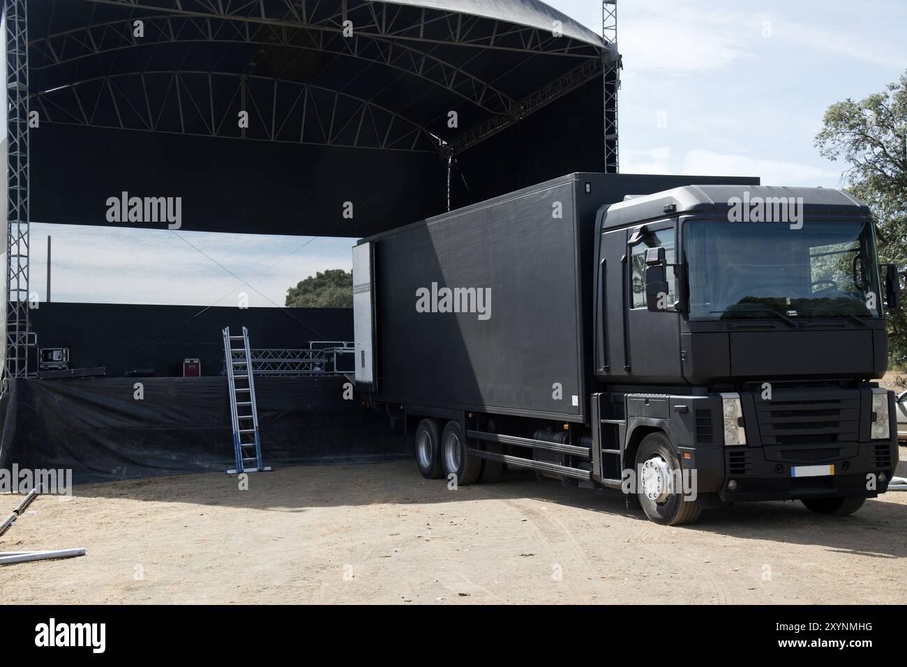 Truck near a concert stage starting setting it up Stock Photo