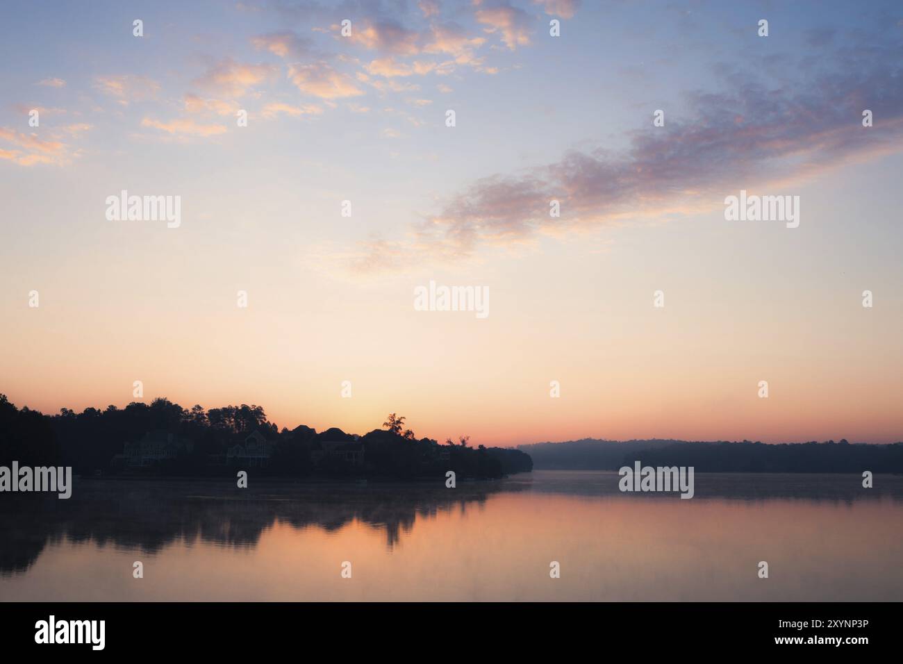 Misty morning at the lake Stock Photo - Alamy