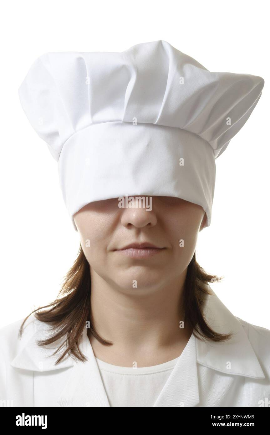 Chef woman hiding her eyes under her hat Stock Photo