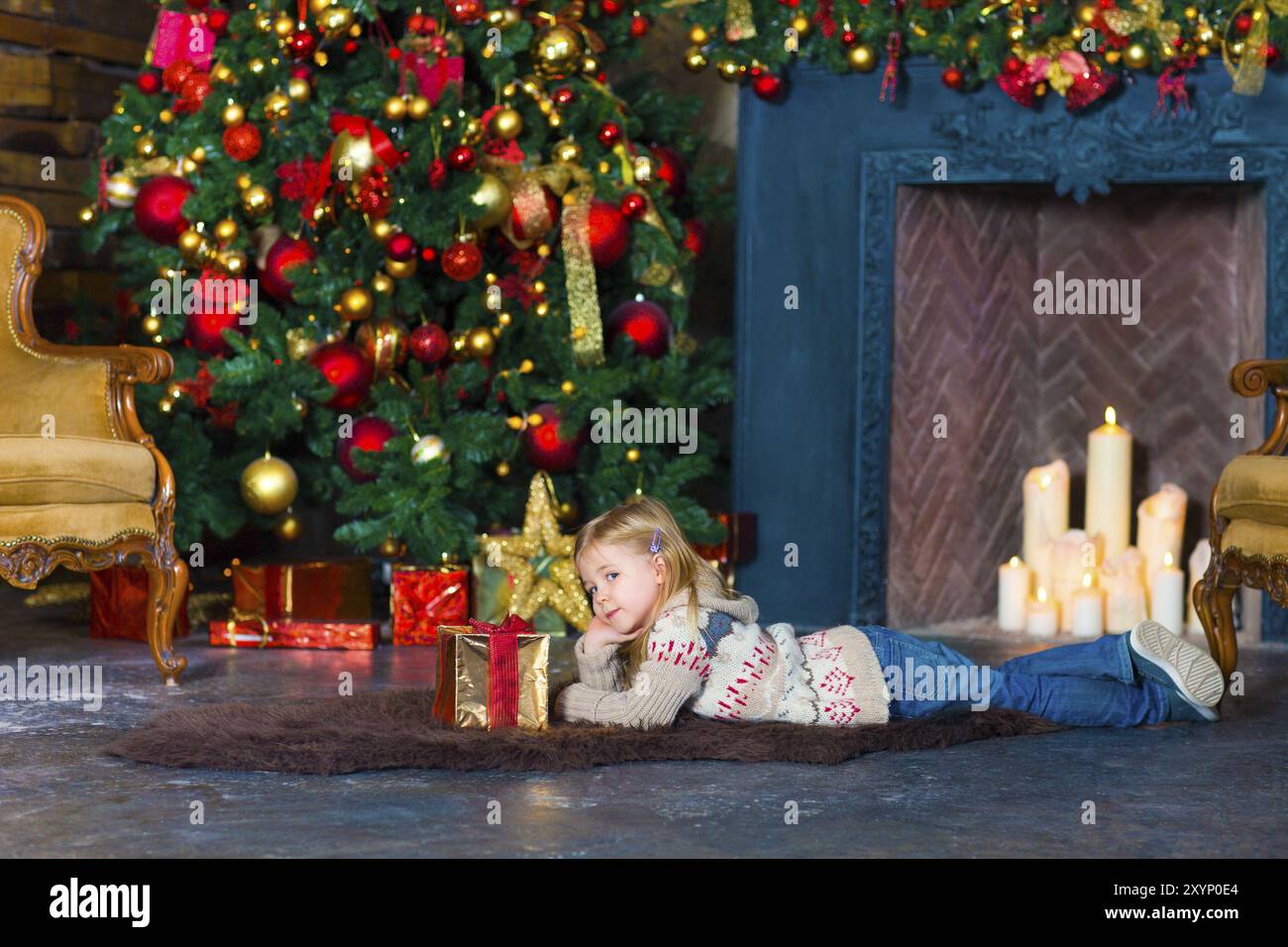 Happy little smiling girl with christmas gift box indoor Stock Photo ...