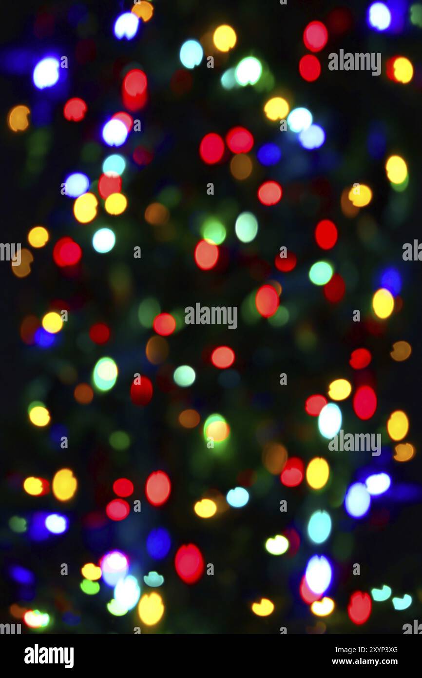 Holiday background from unfocused color lights Stock Photo