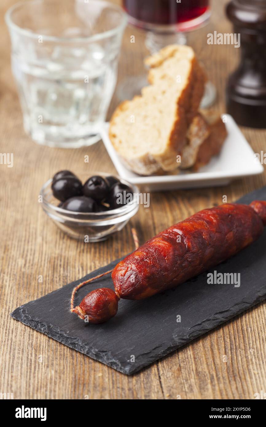 Spanish chorizo sausage on black slate Stock Photo - Alamy