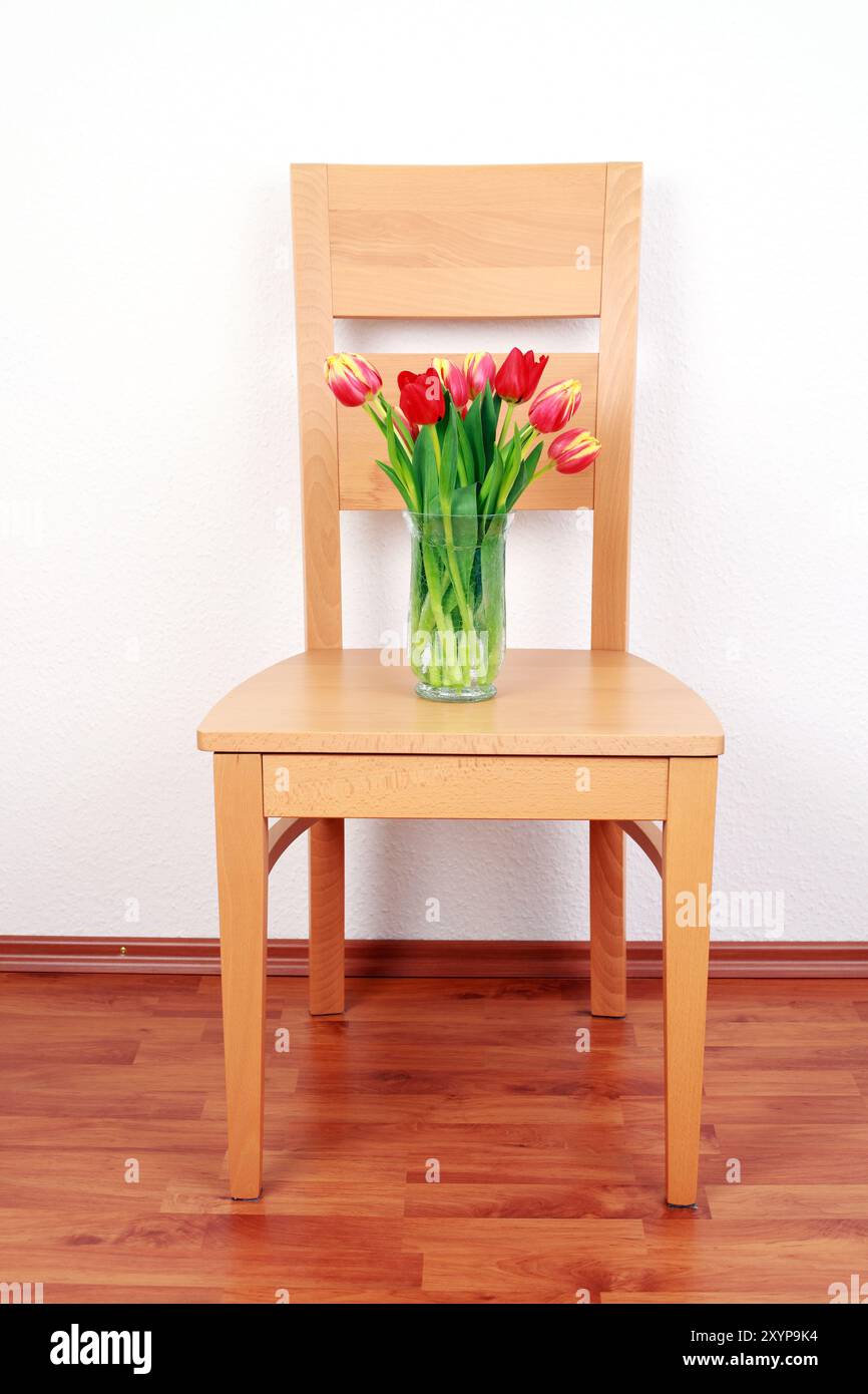 Chair with flowers on the wall Stock Photo Alamy — free download
