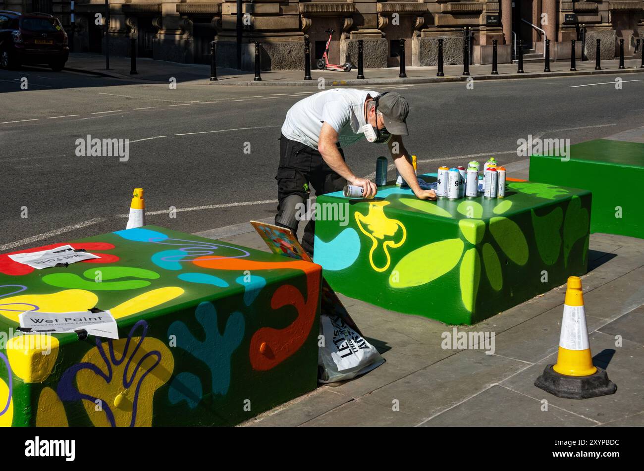 Blocks In Street Street artist adds cheerful positive colours to traffic blocks on ...