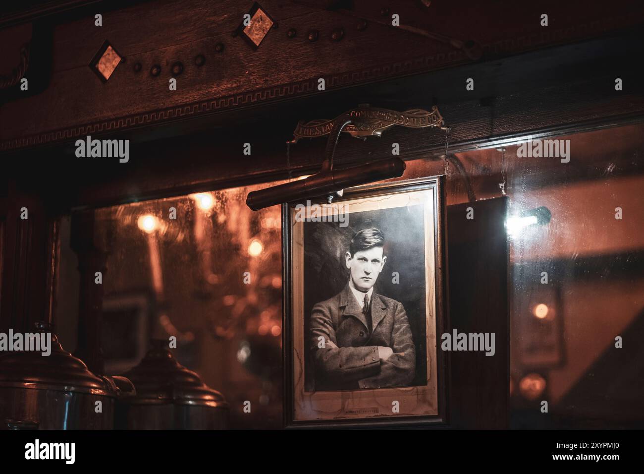A water-stained portrait of Irish independence leader Michael Collins on the bar at O'Connell's Pub in St. Louis, Missouri, USA Stock Photo