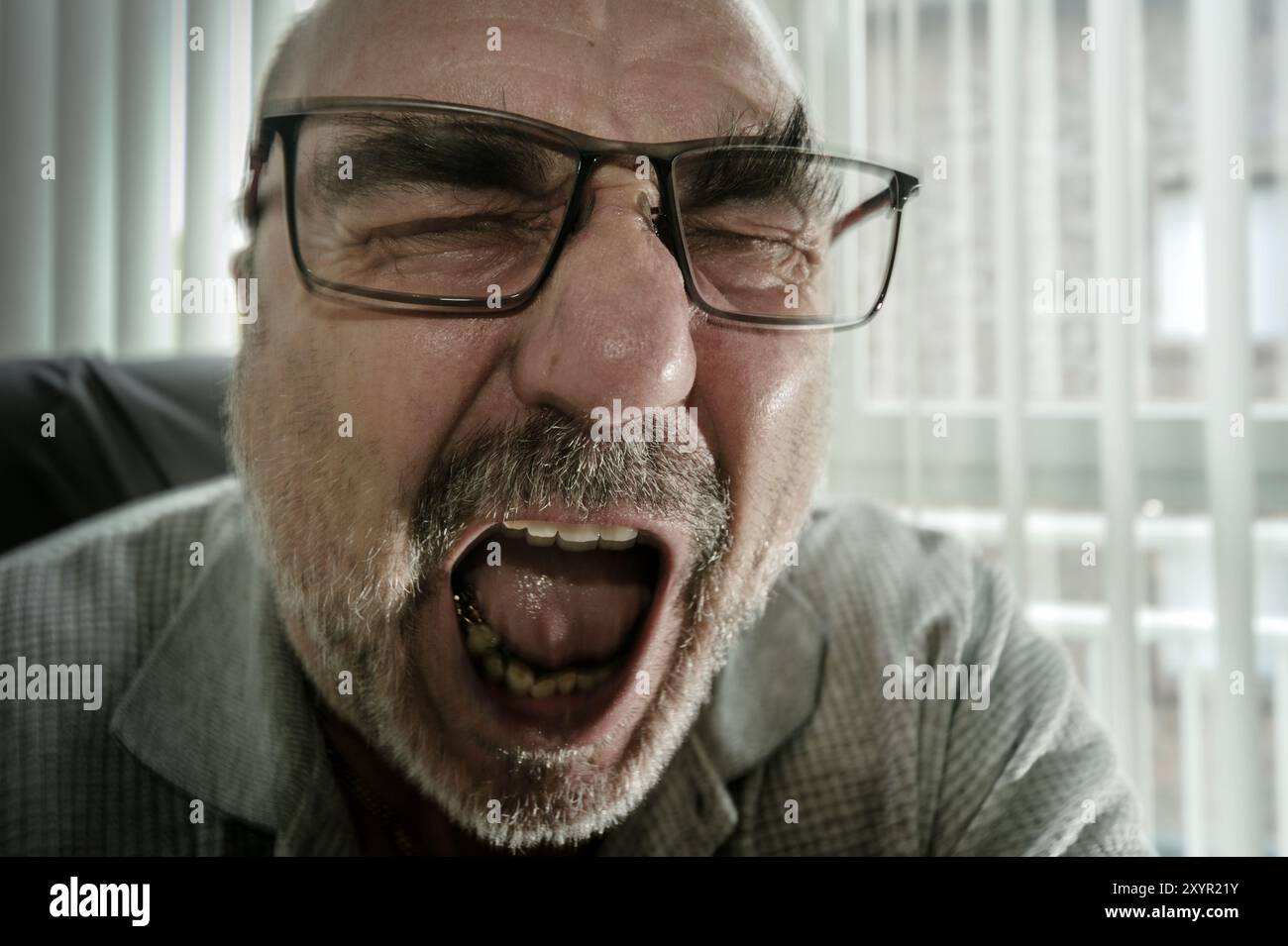 Portrait of a man screaming with rage Stock Photo