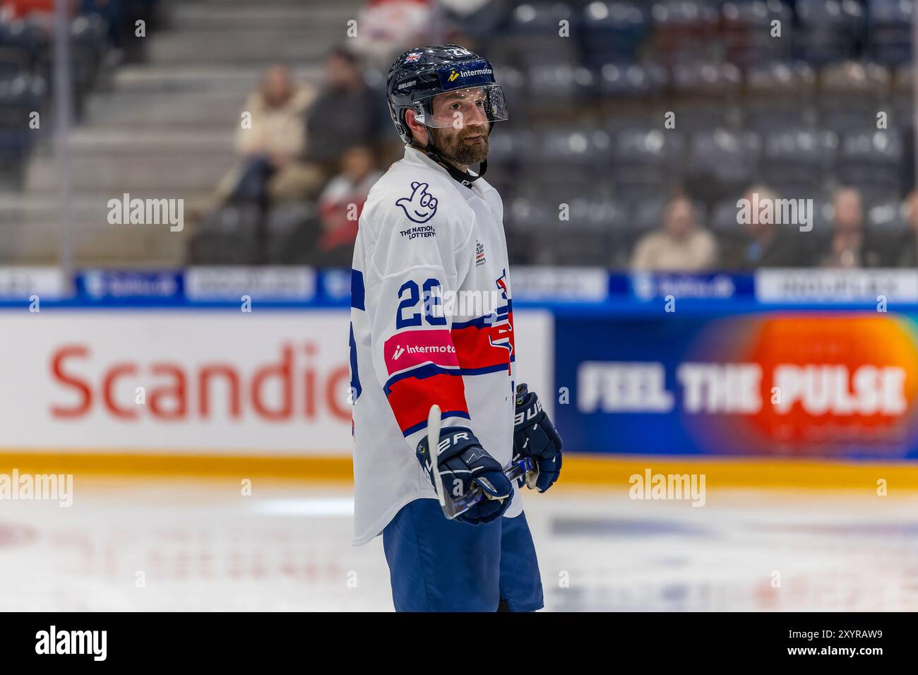 Aalborg, Denmark. 30th Aug, 2024. Evan Mosey (26) of Great Britain seen during the IIHF Men's Olympic Ice Hockey Qualification match between Norway and Great Britain in Group F at Aalborg Arena in Aalborg. Credit: Gonzales Photo/Alamy Live News Stock Photo