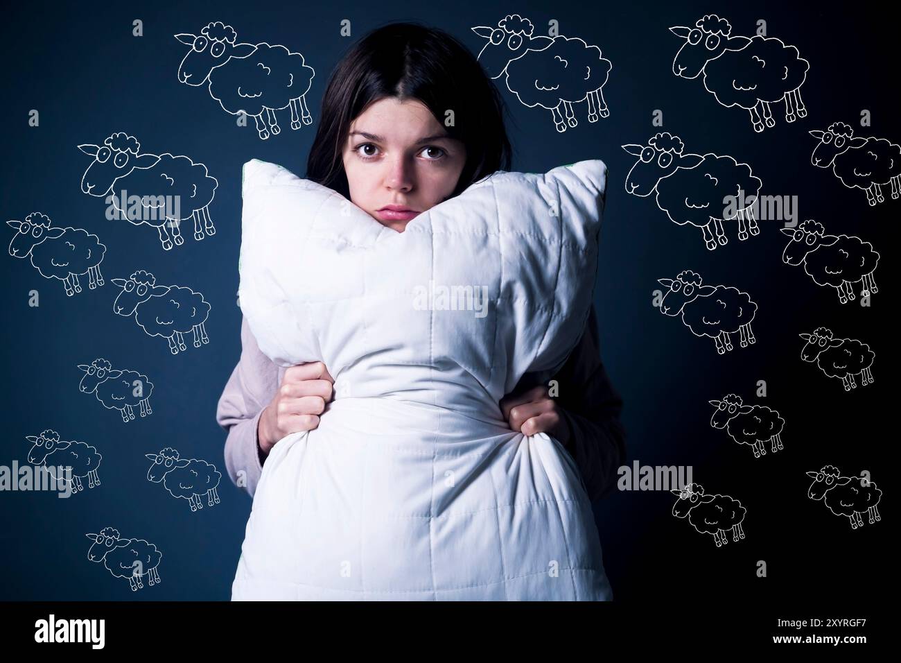 Funny girl with disgruntled offended face hugs a pillow Stock Photo - Alamy