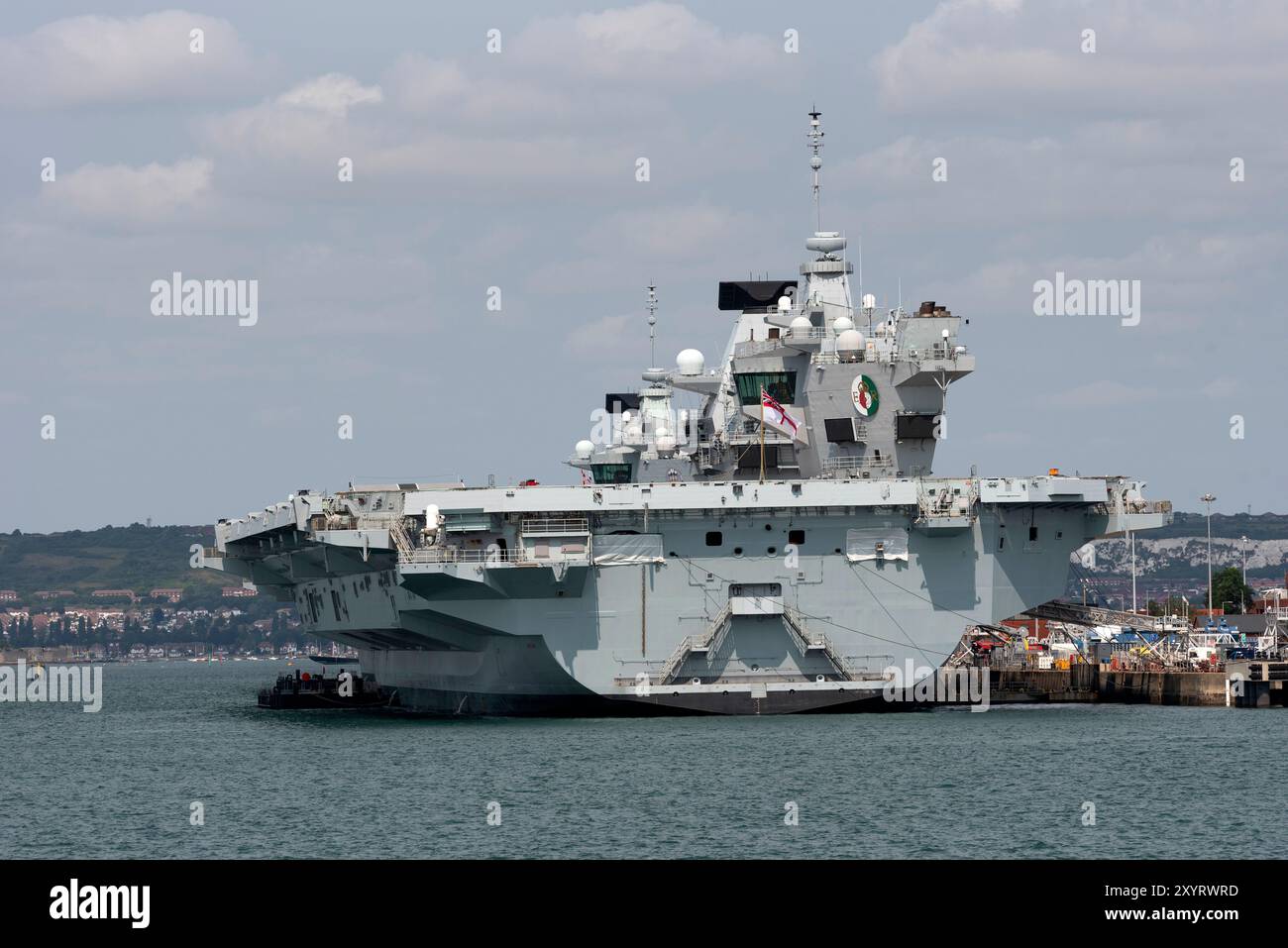 Portsmouth England UK. 18.08.2024. Two aircraft carriers berthed in Portsmouth dockyard stern of HMS Queen Elizabeth seen here. Stock Photo