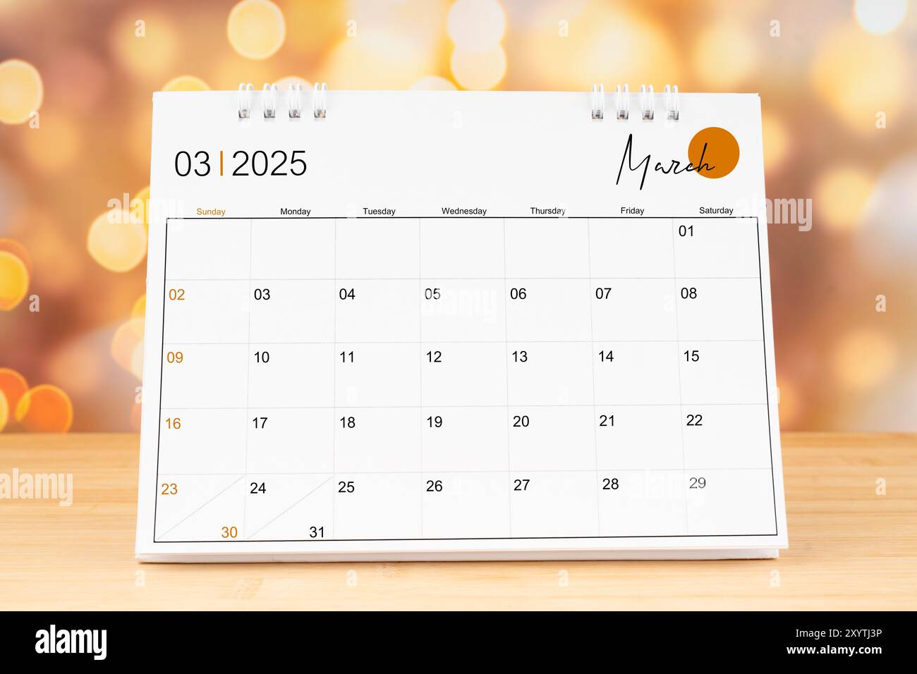 march-2025-desk-calendar-on-wooden-table-with-gold-light-bokeh-background-new-year-concept-stock-photo-alamy