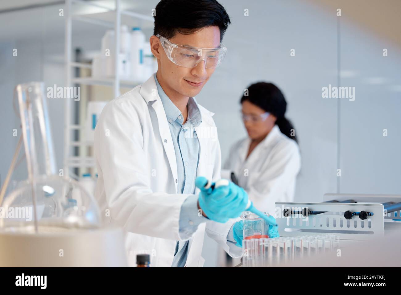 Scientist, test tube and pipette in lab for experiment, biotechnology ...
